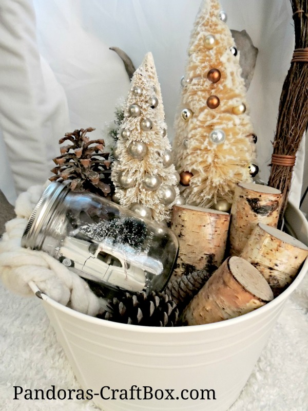 winter wonderland, metal tub decor, white tub, bottle brush tree, wood decor, wood slices, mason jar, snow globe, knitted blanket, arm knitted, pine cones, IKEA,